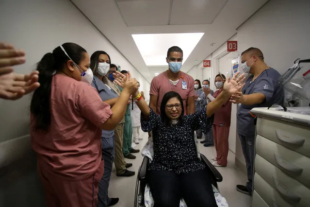Cassia de Almeida, an ICU nurse of Sao Luiz Hospital, who was hospitalized with severe symptoms of coronavirus disease (COVID-19), waves to her colleagues after being discharged in Sao Paulo, Brazil, May 30, 2020. (Photo by Rahel Patrasso/Reuters)