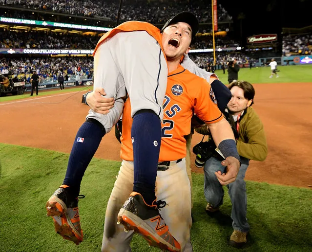 Alex Bregman #2 and Jose Altuve #27 of the Houston Astros celebrate after defeating the Los Angeles Dodgers 5-1 in game seven to win the 2017 World Series at Dodger Stadium on November 1, 2017 in Los Angeles, California. (Photo by Harry How/Getty Images)