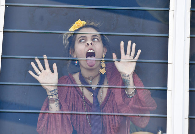 American actress Paris Jackson pulls faces at photographers during the “Melbourne Cup” race day festivities in Melbourne, Australia on November 7, 2017. (Photo by Media-Mode/Splash News and Pictures)