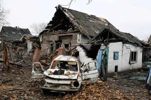A damaged Soviet-era Ukrainian car “Zaporozhets” is seen next to a destroyed apartment building after Russian shelling in Pokrovsk, Donetsk region, Ukraine, Friday, November 4, 2022. (Photo by Andriy Andriyenko/AP Photo)