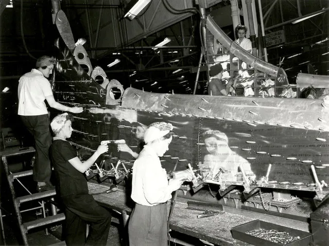 Female riveters are shown assembling the tail fin of a B-17 Flying Fortress at The Boeing Company's Plant 2 in this 1943 publicity photo from the Boeing Company. Boeing/Handout via Reuters
