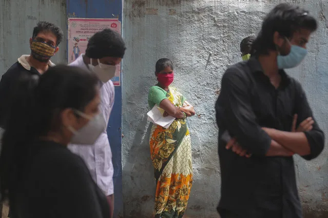 People wait to give their nasal swab samples to test for COVID-19 in Hyderabad, India, Friday, August 28, 2020. India has the third-highest coronavirus caseload after the United States and Brazil, and the fourth-highest death toll in the world. (Photo by Mahesh Kumar A./AP Photo)