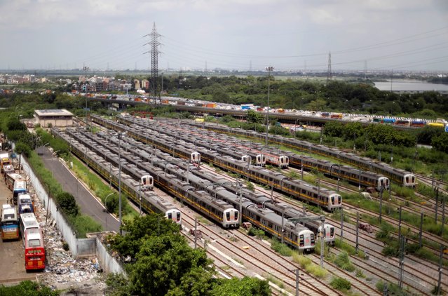 Delhi Metro trains are seen parked at a depot ahead of the restart of their operation in New Delhi, India, September 1, 2020. (Photo by Adnan Abidi/Reuters)
