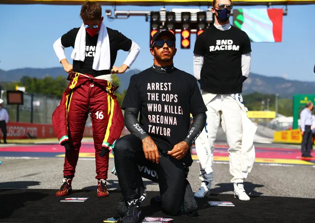 Lewis Hamilton of Great Britain and Mercedes GP wears a t-shirt displaying the message “arrest the cops who killed Breonna Taylor” as he takes a knee on the grid in support of ending racism before the F1 Grand Prix of Tuscany at Mugello Circuit on September 13, 2020 in Scarperia, Italy. (Photo by Dan Istitene – Formula 1/Formula 1 via Getty Images)