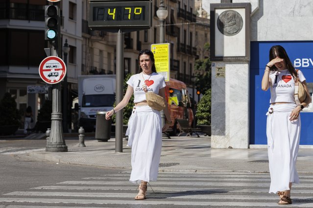 A street digital board shows temperature as 47 degrees Celsius in Granada, Spain on July 17, 2025. The southern Spanish city continues to experience extreme heat conditions as part of the summer heatwave affecting the region. (Photo by Alex Camara/Anadolu via Getty Images)