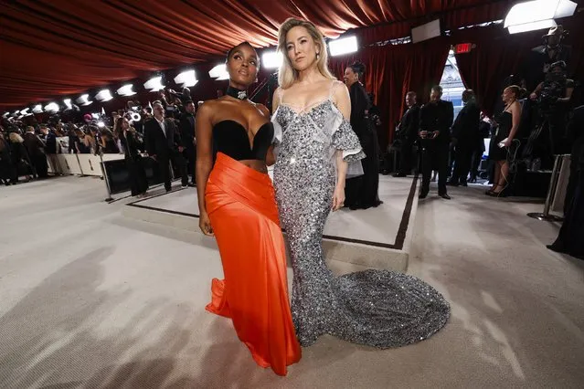 American singer Janelle Monae and American actress Kate Hudson pose on the champagne-colored red carpet during the Oscars arrivals at the 95th Academy Awards in Hollywood, Los Angeles, California, U.S., March 12, 2023. (Photo by Mario Anzuoni/Reuters)