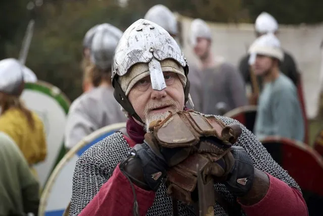 Re-enactors dress in historical costume as part of the Battle of Hastings anniversary commemoration events in Battle, Britain October 15, 2016. (Photo by Neil Hall/Reuters)