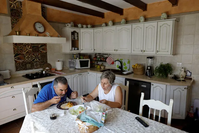 Maria Jose Manzano, 50, and her husband Joaquin Cortijo, 57, have lunch at their house in Vega de los Molinos, part of the white village of Arcos de la Frontera, southern Spain September 23, 2016. (Photo by Marcelo del Pozo/Reuters)