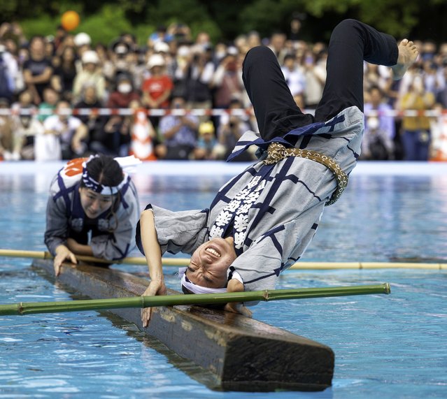A competitor bangs his head during square log rolling (Kiba no kakunori) in Kiba Park as part of the Koto-ku Folk Performing Arts Festival in Tokyo, Japan on October 18, 2025. (Photo by Mark Edward Harris/ZUMA Press Wire/Rex Features/Shutterstock)