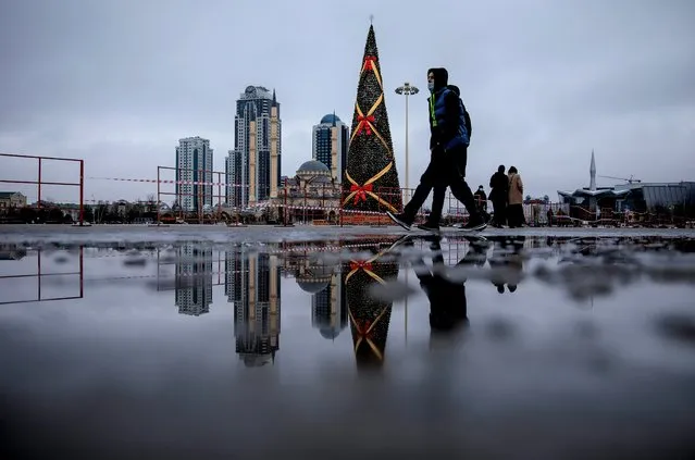 A Christmas tree against the background of the Grozny City towers and the Akhmad Kadyrov Mosque (Heart of Chechnya) in Grozny, Russia on December 28, 2020. (Photo by Yelena Afonina/TASS)