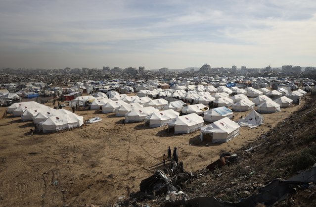 Displaced Palestinians try to survive in makeshift tents, set up on top of the rubble, in Zeitoun neighborhood of Gaza City, Gaza on November 17, 2025. Despite the lack of basic necessities, people, who struggle to find shelter and warmth, continue to live their daily lives under difficult conditions in the aftermath of the war. (Photo by Khames Alrefi/Anadolu via Getty Images)