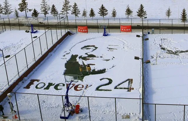 Art students create an image of NBA Los Angeles Lakers forward Kobe Bryant and "Forever 24" by clearing snow from a basketball court, to mark the player's retiring announcement, at Beihua University in Jilin, Jilin province, China, December 6, 2015. (Photo by Reuters/Stringer)
