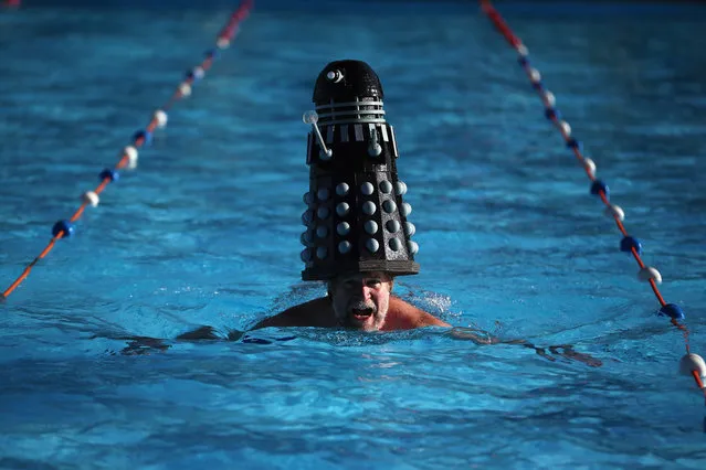 A competitor with a Dalek on his head takes part in the annual UK Cold Water Swimming Championships at Tooting Bec Lido on January 24, 2015 in London, England. Participants from around the world brave the cold water to compete in a selection of different swimming races. (Photo by Dan Kitwood/Getty Images)