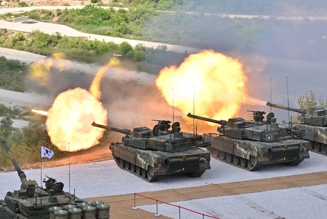 South Korea's K-2 tanks fire during a South Korea-US joint military drill at Seungjin Fire Training Field in Pocheon on June 15, 2023. (Photo by Jung Yeon-Je/Pool via AFP Photo)