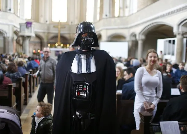 People dressed as characters from the movie Star Wars attend a service at the church Zionskirche in Berlin, Germany, December 20, 2015. (Photo by Hannibal Hanschke/Reuters)