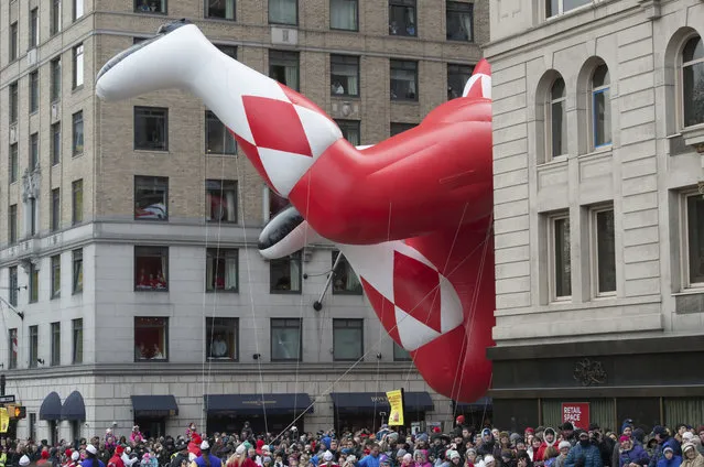 A Mighty Morphin Power Ranger balloon turns onto Sixth Avenue during the Macy's Thanksgiving Day Parade, Thursday, November 24, 2016, in New York. (Photo by Bryan R. Smith/AP Photo)