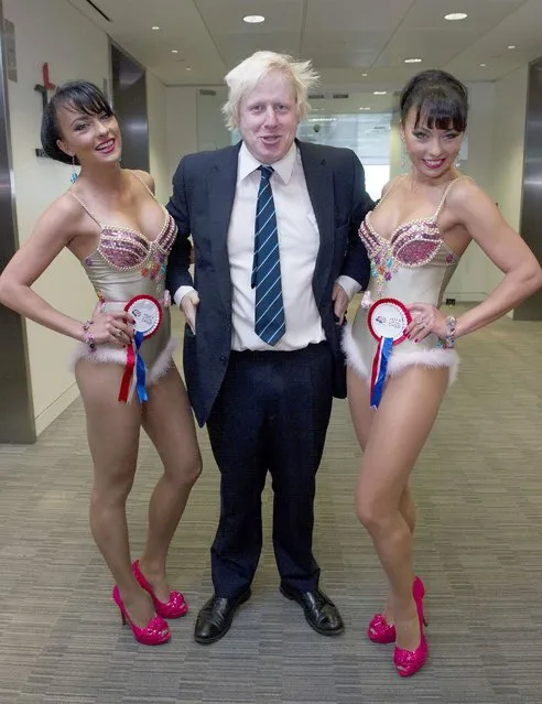 Mayor of London Boris Johnson and the Cheeky Girls help out on the trading floor at the BGC Partner's 7th Annual Charity Trading Day, at Churchill Place in Canary Wharf, east London, England on September 12, 2011. (Photo by Alan Davidson/Rex Features/Shutterstock)