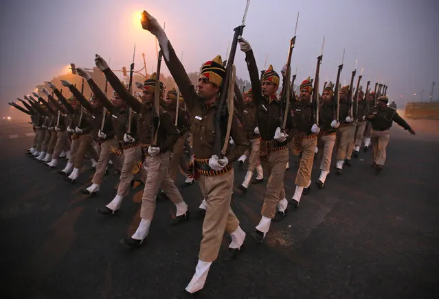 Indian paramilitary soldiers are seen rehearsing for the Republic Day parade during the early morning hours in New Delhi, India, January 7, 2016. India will mark its Republic Day on Jan. 26. (Photo by Rajat Gupta/EPA)