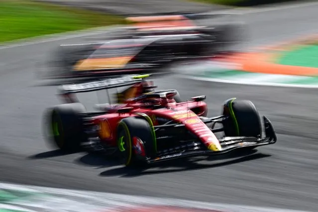 Ferrari's Spanish driver Carlos Sainz Jr (Bottom) drives in front of Red Bull Racing's Dutch driver Max Verstappen during the Italian Formula One Grand Prix race at Autodromo Nazionale Monza circuit, in Monza on September 3, 2023. (Photo by Ben Stansall/AFP Photo)