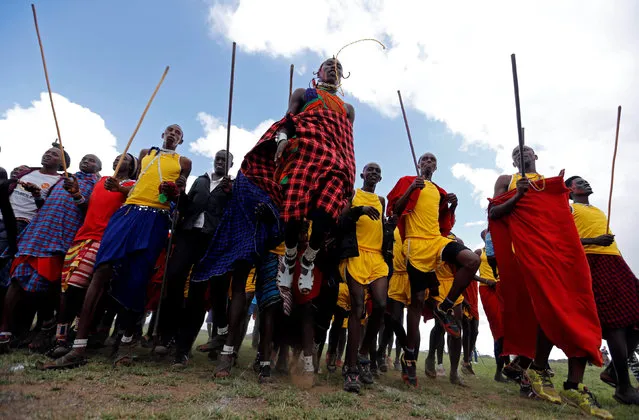 Maasai moran athletes sing and jump in their traditional style as they prepare for the 2016 Maasai Olympics at the Sidai Oleng Wildlife Sanctuary, at the base of Mt. Kilimanjaro, near the Kenya-Tanzania border in Kimana, Kajiado, Kenya December 10, 2016. (Photo by Thomas Mukoya/Reuters)