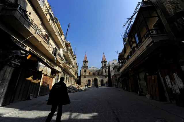 A man walks in Farhat Square, a government-controlled area of Aleppo, Syria December 10, 2016. (Photo by Omar Sanadiki/Reuters)