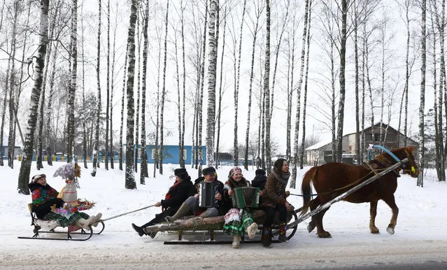 Villagers take part in Kolyada holiday celebrations in the village of Martsiyanauka, Belarus, January 21, 2016. (Photo by Vasily Fedosenko/Reuters)