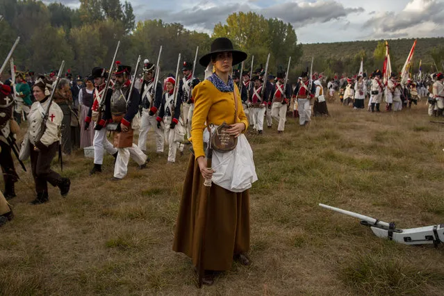 An historical re-enactor prepares to light a powder cannon during a re-enactment of a Napoleonic battle against allied army on October 13, 2018 in Astorga, Leon region, Spain. Around 1000 re-enactors will take part throughout the weekend in the “Three Nations in Astorga” historical re-enactment, which commemorates the 210th anniversary of the arrival of Napoleon Bonaparte to Astorga during the “Guerra de la Independencia Española” (Spanish War of Independence) or (Peninsular War). The Spanish army led by Marquis of La Romana and the British army led by sir John Moore lost the battle against the French army and Napoleon allowed them to retire and leave Astorga. (Photo by Pablo Blazquez Dominguez/Getty Images)