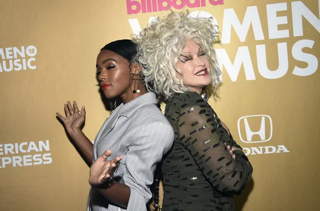 Janelle Monae, left, and Cyndi Lauper attend the 13th annual Billboard Women in Music event at Pier 36 on Thursday, December 6, 2018, in New York. (Photo by Evan Agostini/Invision/AP Photo)