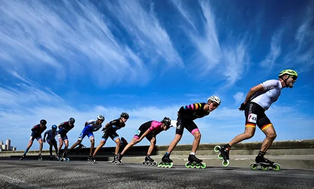 Roller skaters compete during the 3rd World Marathon Speed Skating Masters Championships in Havana on December 10, 2023. (Photo by Yamil Lage/AFP Photo)