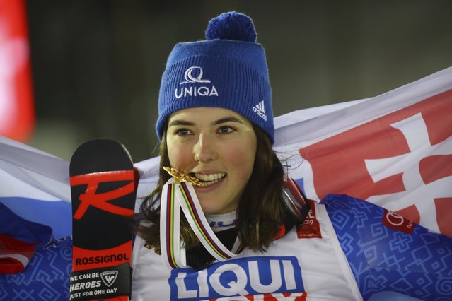 Slovakia's Petra Vlhova bites her gold medal of the women's giant slalom, at the alpine ski World Championships in Are, Sweden, Thursday, February 14, 2019. (Photo by Marco Trovati/AP Photo)