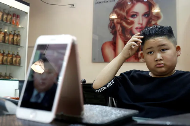 To Gia Huy, 9, has a haircut in a North Korean leader Kim Jong Un style in a haircut salon in Hanoi, Vietnam February 19, 2019. (Photo by Reuters/Kham)