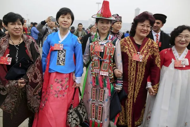 Delegates wearing traditional costumes arrive for the opening session of the Chinese People's Political Consultative Conference (CPPCC) at the Great Hall of the People in Beijing, China, March 3, 2016. (Photo by Aly Song/Reuters)
