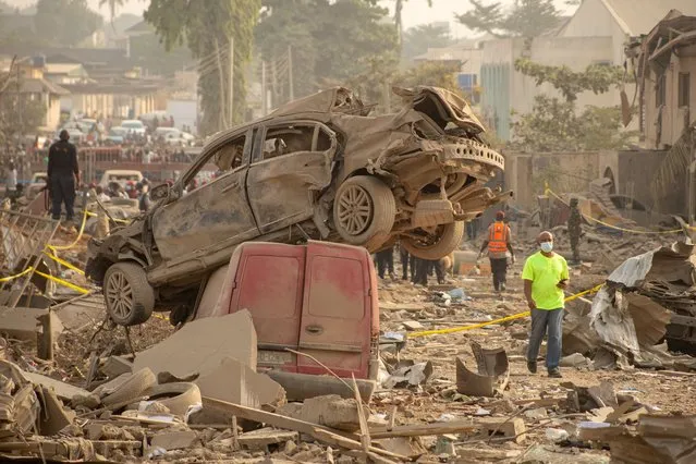 Car wreckages sit on top of rubbles after an explosion in Ibadan, Oyo State, Nigeria, 17 January 2024. Two people have been confirmed dead and 77 others injured in the explosion that occurred on 16 January evening. Preliminary investigations attributed the cause of the blast to illegal miners occupying one of the houses where they stored explosive devices, according to a statement released by the regional governor Seyi Makinde. (Photo by Emmanuel Adefolarin Agboye/EPA/EFE/Rex Features/Shutterstock)