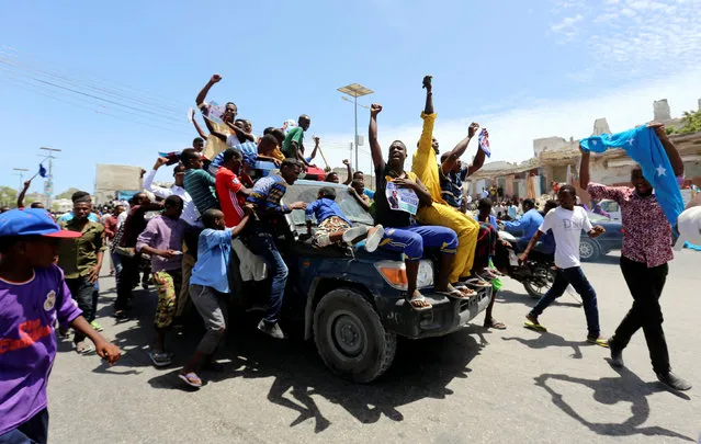 Civilians ride on a Somali police car as they celebrate the election of President Mohamed Abdullahi Mohamed in the streets of Somalia's capital Mogadishu, February 9, 2017. (Photo by Feisal Omar/Reuters)
