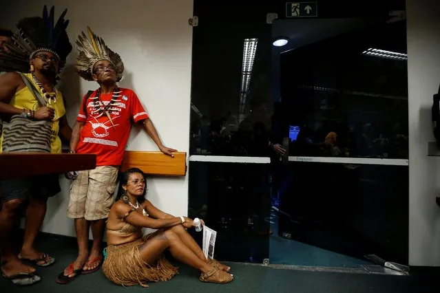 Indigenous Brazilian people attend a meeting with congressmen during the Terra Livre camp, or Free Land camp, at the National Congress in Brasilia, April 25, 2019. (Photo by Adriano Machado/Reuters)