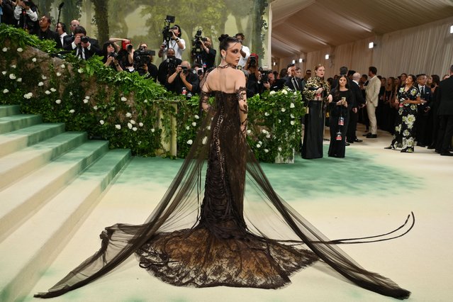 US social media personality Emma Chamberlain arrives for the 2024 Met Gala at the Metropolitan Museum of Art on May 6, 2024, in New York. The Gala raises money for the Metropolitan Museum of Art's Costume Institute. The Gala's 2024 theme is “Sleeping Beauties: Reawakening Fashion”. (Photo by Angela Weiss/AFP Photo)