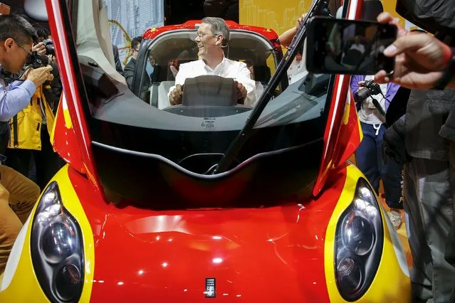 Andrew Hepher of Royal Dutch Shell, sits inside a high-efficiency petrol-burning concept car as it is unveiled during a ceremony in Beijing, China April 22, 2016. (Photo by Damir Sagolj/Reuters)