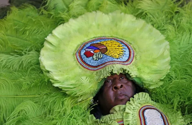 A member of the Mowhawk Hunters Mardi Gras Indians performs at the New Orleans Jazz and Heritage Festival in New Orleans, Saturday, April 23, 2016. (Photo by Gerald Herbert/AP Photo)