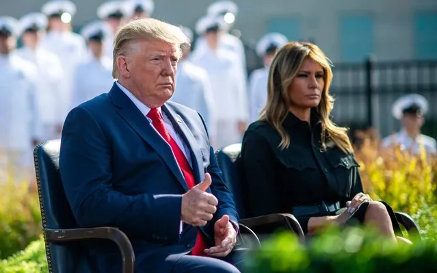 US President Donald J. Trump (L) gives a thumbs-up next to First Lady Melania Trump as they attend a ceremony at the Pentagon during the 18th anniversary commemoration of the September 11 terrorist attacks, in Arlington, Virginia, 11 September 2019. (Photo by Kevin Dietsch/EPA/EFE/Pool)