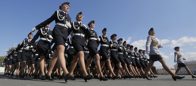 Russian Police academy female cadets march during a rehearsal for the Victory Day military parade at Dvortsovaya (Palace) Square in St Petersburg, Russia, Wednesday, May 7, 2014. Victory Day, marking the defeat of Nazi Germany, is Russia's most important secular holiday celebrated on May 9. (Photo by Dmitry Lovetsky/AP Photo)