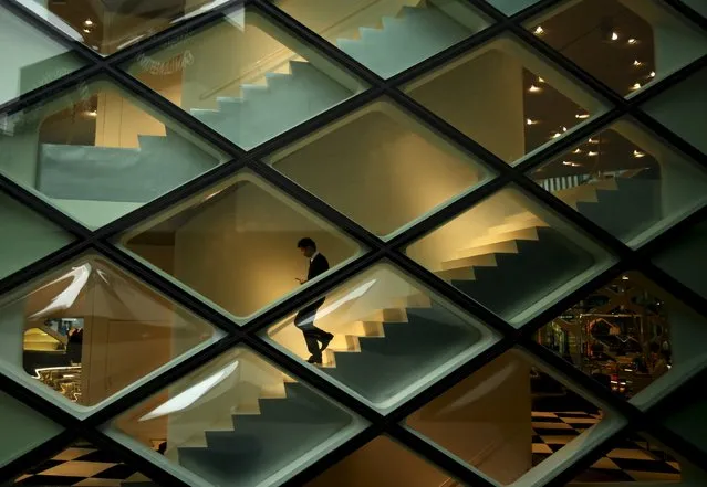 A man goes down the stairs inside a luxury brand store at a shopping district in Tokyo, Japan, July 1, 2015. (Photo by Yuya Shino/Reuters)