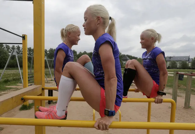 Estonia's olympic team female marathon runners triplets Lily (front), Leila (L) and Liina Luik exercise during a training session in Tartu, Estonia, May 26, 2016. (Photo by Ints Kalnins/Reuters)