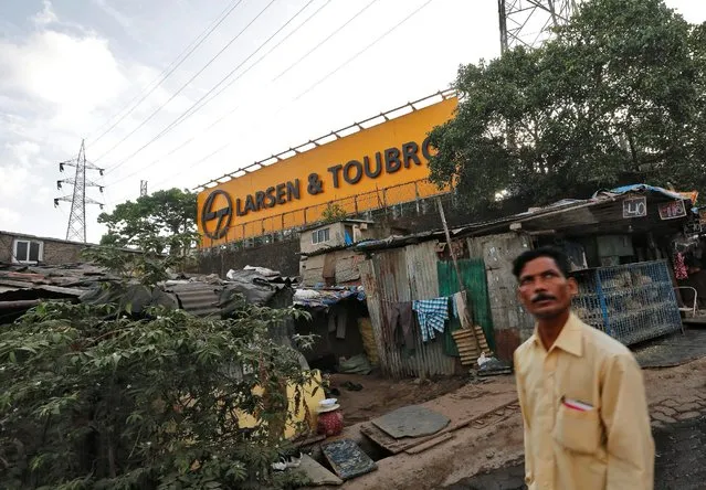 A man walks through a slum outside the Larsen and Toubro (L&T) factory in Mumbai, India May 25, 2016. (Photo by Shailesh Andrade/Reuters)