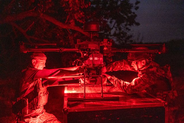 Ukrainian soldiers from the 121nd load a Vampire drone with an antitank mine to strike into Russian positions in Krasnogorivka frontline, Ukraine on July 22, 2024. (Photo by Pablo Miranzo/Anadolu via Getty Images)