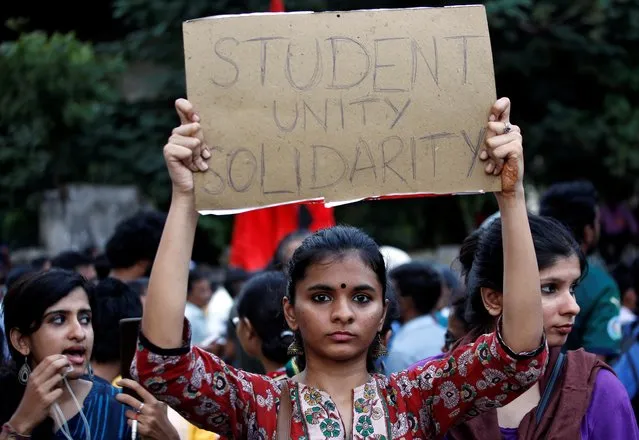 A demonstrator displays a placard during a protest march to show solidarity with the students of New Delhi's Jamia Millia Islamia university after police entered the university campus on Sunday following a protest against a new citizenship law, in Chennai, India, December 16, 2019. (Photo by P. Ravikumar/Reuters)