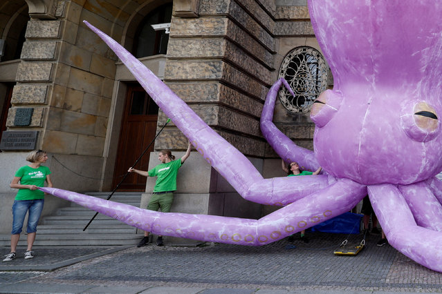 Greenpeace activists stage a protest demanding an end to deep sea mining, in front of the Ministry of Industry in Prague, Czech Republic on June 1, 2023. (Photo by David W. Cerny/Reuters)