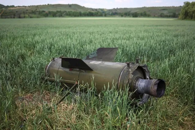 Remains of a Russian Tochka-U ballistic missile are seen in a winter wheat field, amid Russia's invasion of Ukraine, near the town of Soledar, Donetsk region Ukraine on June 8, 2022. (Photo by Gleb Garanich/Reuters)