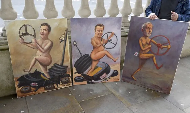 An artist displays portraits of Britain's Chancellor of the Exchequer George Osborne (L), Prime Minister David Cameron (C) and the leader of the oppostion Labour party Jeremy Corbyn in central London, Britain June 27, 2016. (Photo by Toby Melville/Reuters)