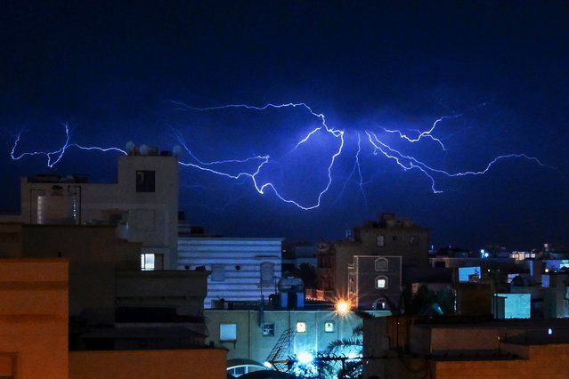 Lightning strikes over Kuwait City during a thunder storm early on May 6, 2024. (Photo by Yasser Al-Zayyat/AFP Photo)