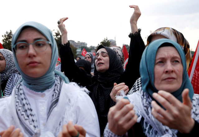 Demonstrators pray during a protest to express support for Palestinians in Gaza, a day ahead of the anniversary of the October 7th attack in Istanbul, Turkey on October 6, 2024. (Photo by Dilara Senkaya/Reuters)